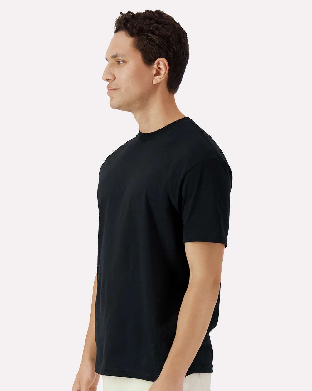 Black Gildan 3000 unisex cotton T-shirt from Varaprint, shown from the side on a high-model display.