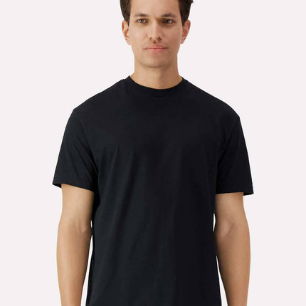 Black Gildan 3000 Unisex Light Cotton T-Shirt by Varaprint, front view on a high model.