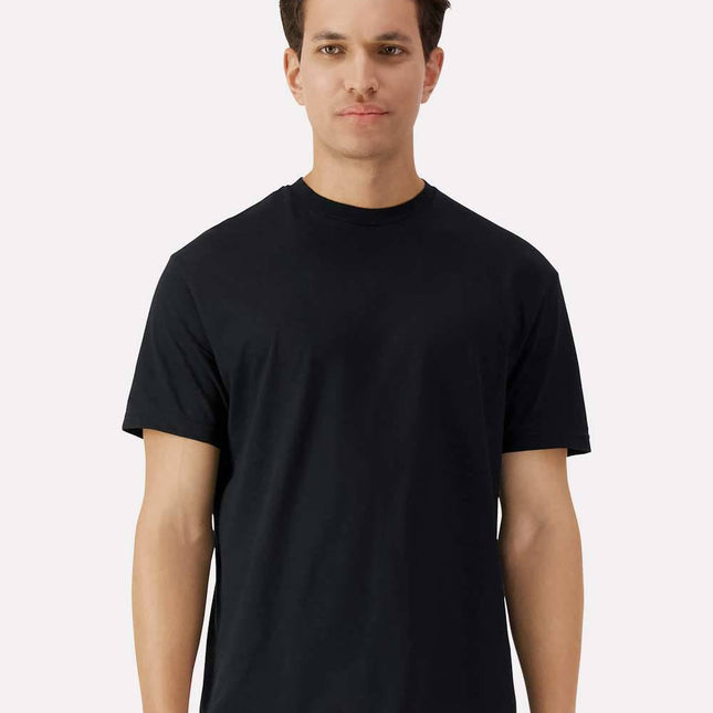 Black Gildan 3000 Unisex Light Cotton T-Shirt by Varaprint, front view on a high model.