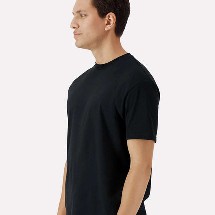 Black Gildan 3000 unisex cotton T-shirt from Varaprint, shown from the side on a high-model display.
