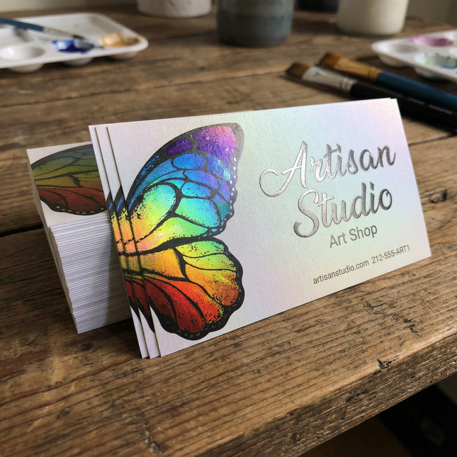 Sparkling metallic business cards with a shiny, reflective surface from Varaprint, showcasing a sleek and professional design.